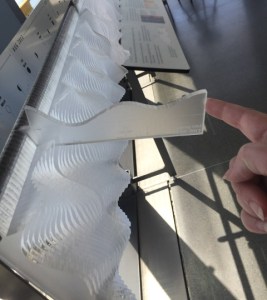 Tide exhibit at the Exploratorium with data represented in tactual and visual formats.